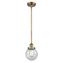 Beacon Mini Pendant shown in the Brushed Brass finish with a Seedy shade