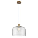 Bell Mini Pendant shown in the Brushed Brass finish with a Clear shade