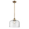 Bell Mini Pendant shown in the Brushed Brass finish with a Clear shade