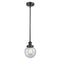 Beacon Mini Pendant shown in the Matte Black finish with a Seedy shade