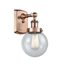 Beacon Sconce shown in the Antique Copper finish with a Seedy shade