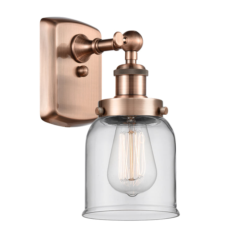 Bell Sconce shown in the Antique Copper finish with a Clear shade