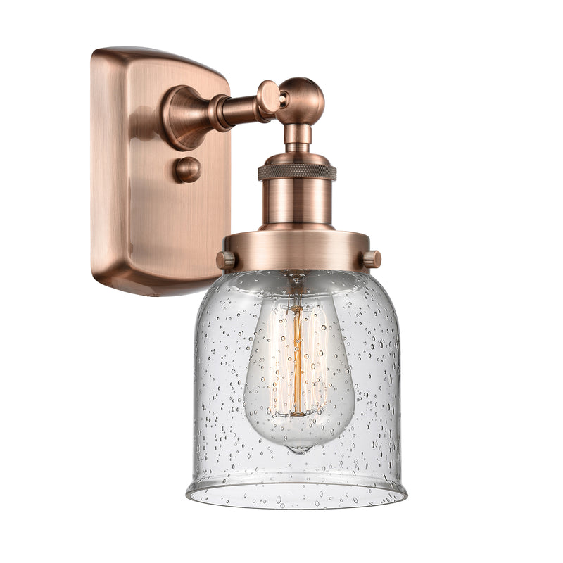 Bell Sconce shown in the Antique Copper finish with a Seedy shade