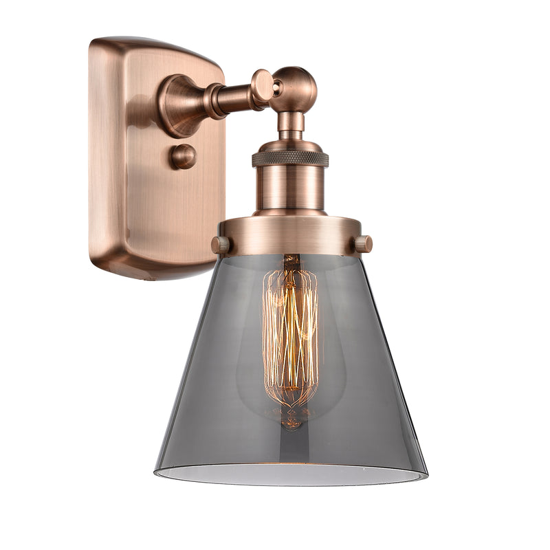 Cone Sconce shown in the Antique Copper finish with a Plated Smoke shade