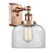 Bell Sconce shown in the Antique Copper finish with a Clear shade