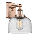 Bell Sconce shown in the Antique Copper finish with a Seedy shade