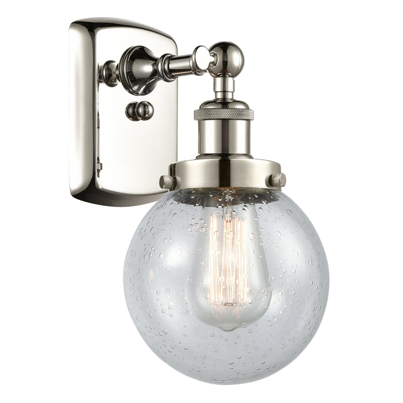 Beacon Sconce shown in the Polished Nickel finish with a Seedy shade