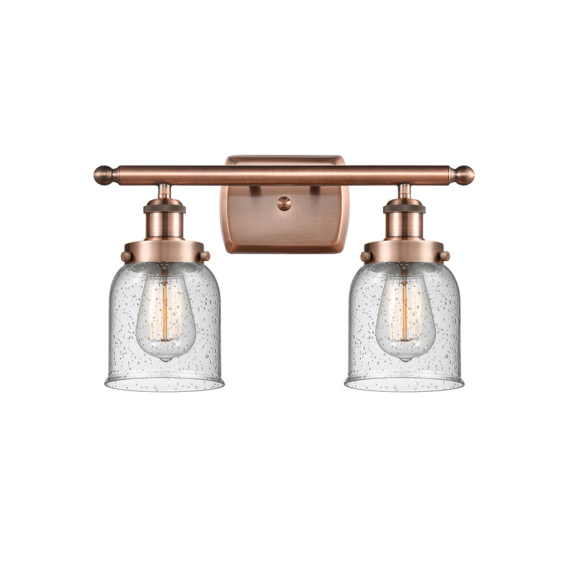 Bell Bath Vanity Light shown in the Antique Copper finish with a Seedy shade