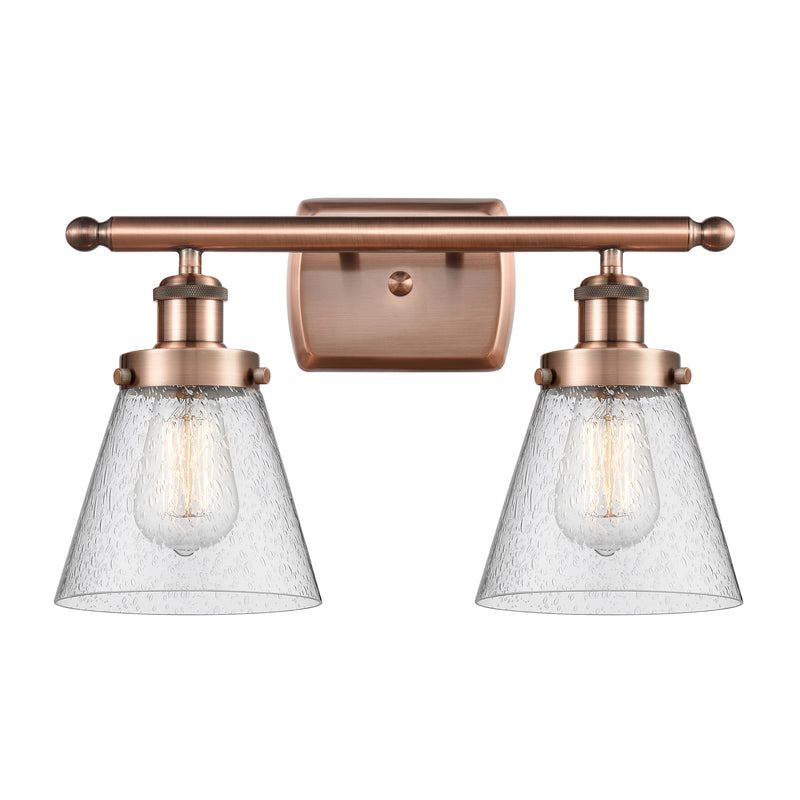 Cone Bath Vanity Light shown in the Antique Copper finish with a Seedy shade