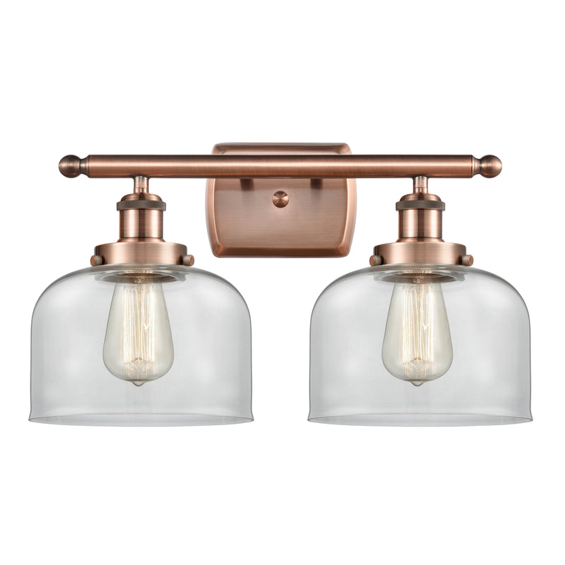 Bell Bath Vanity Light shown in the Antique Copper finish with a Clear shade