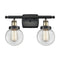 Beacon Bath Vanity Light shown in the Black Antique Brass finish with a Clear shade