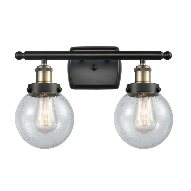 Beacon Bath Vanity Light shown in the Black Antique Brass finish with a Seedy shade