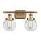 Beacon Bath Vanity Light shown in the Brushed Brass finish with a Clear shade