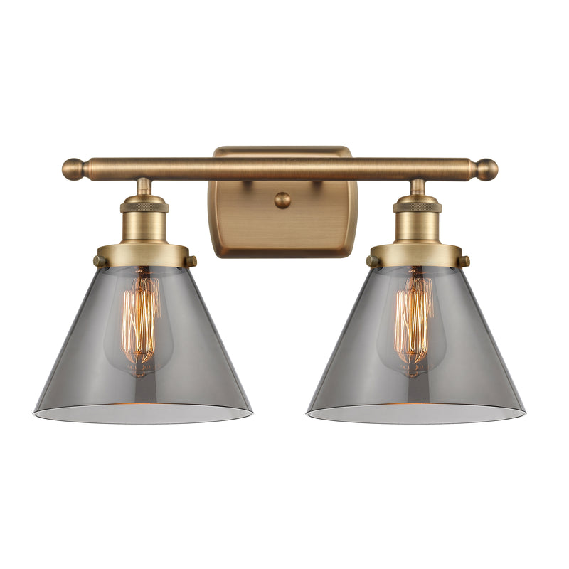 Cone Bath Vanity Light shown in the Brushed Brass finish with a Plated Smoke shade