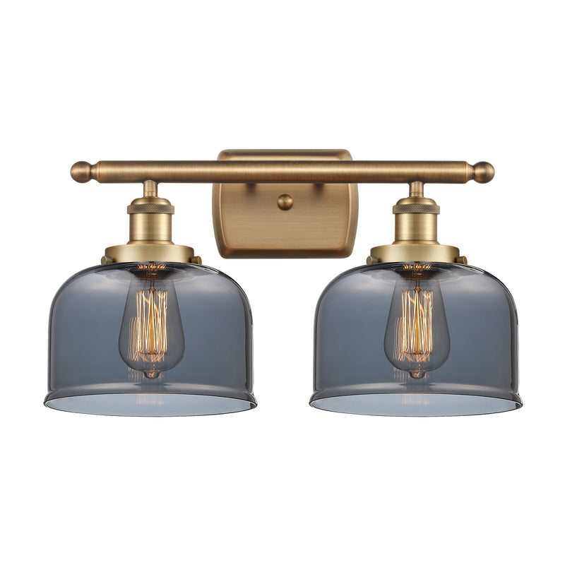 Bell Bath Vanity Light shown in the Brushed Brass finish with a Plated Smoke shade