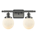 Beacon Bath Vanity Light shown in the Oil Rubbed Bronze finish with a Matte White shade