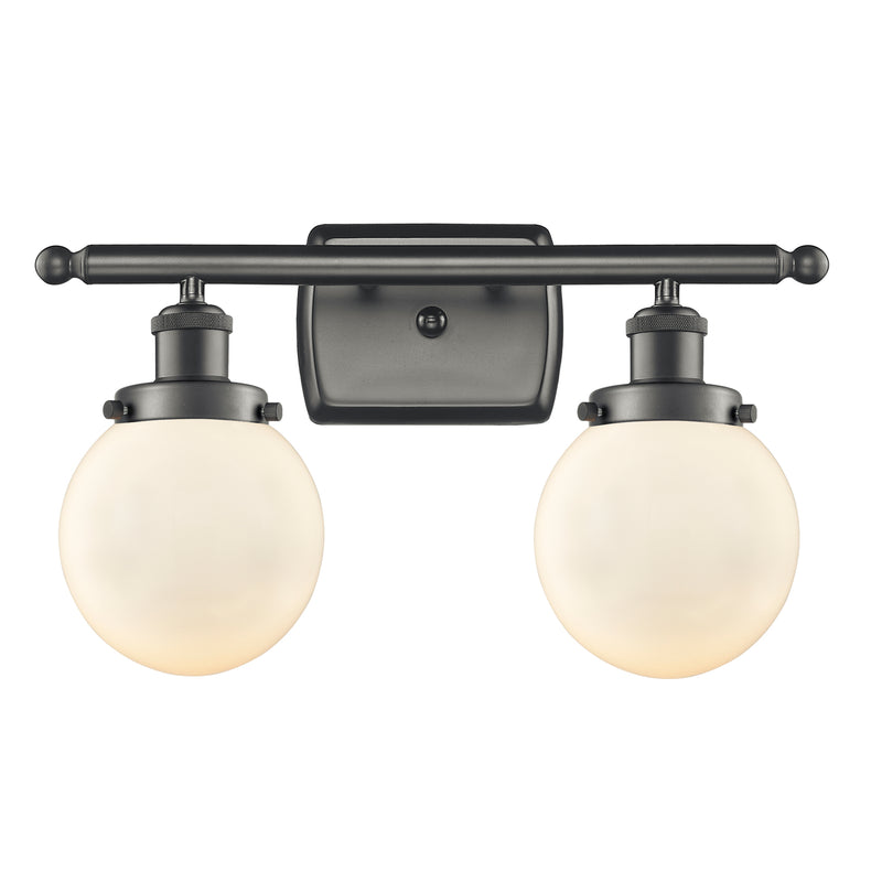 Beacon Bath Vanity Light shown in the Oil Rubbed Bronze finish with a Matte White shade