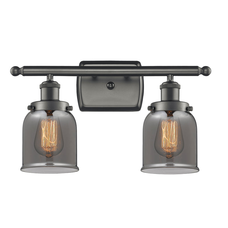 Bell Bath Vanity Light shown in the Oil Rubbed Bronze finish with a Plated Smoke shade