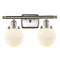 Beacon Bath Vanity Light shown in the Brushed Satin Nickel finish with a Matte White shade