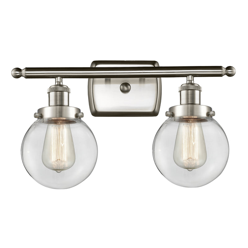 Beacon Bath Vanity Light shown in the Brushed Satin Nickel finish with a Clear shade