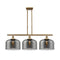 Bell Island Light shown in the Brushed Brass finish with a Plated Smoke shade