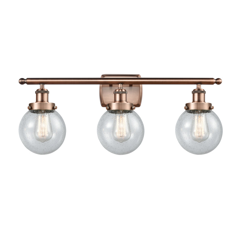 Beacon Bath Vanity Light shown in the Antique Copper finish with a Seedy shade