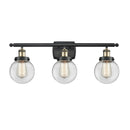 Beacon Bath Vanity Light shown in the Black Antique Brass finish with a Clear shade