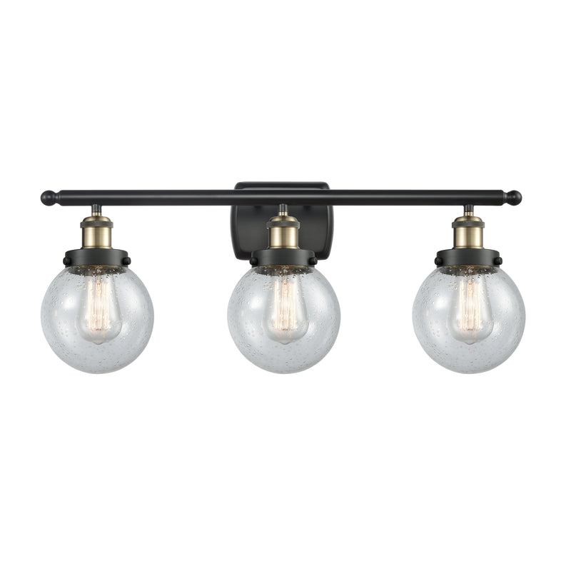 Beacon Bath Vanity Light shown in the Black Antique Brass finish with a Seedy shade