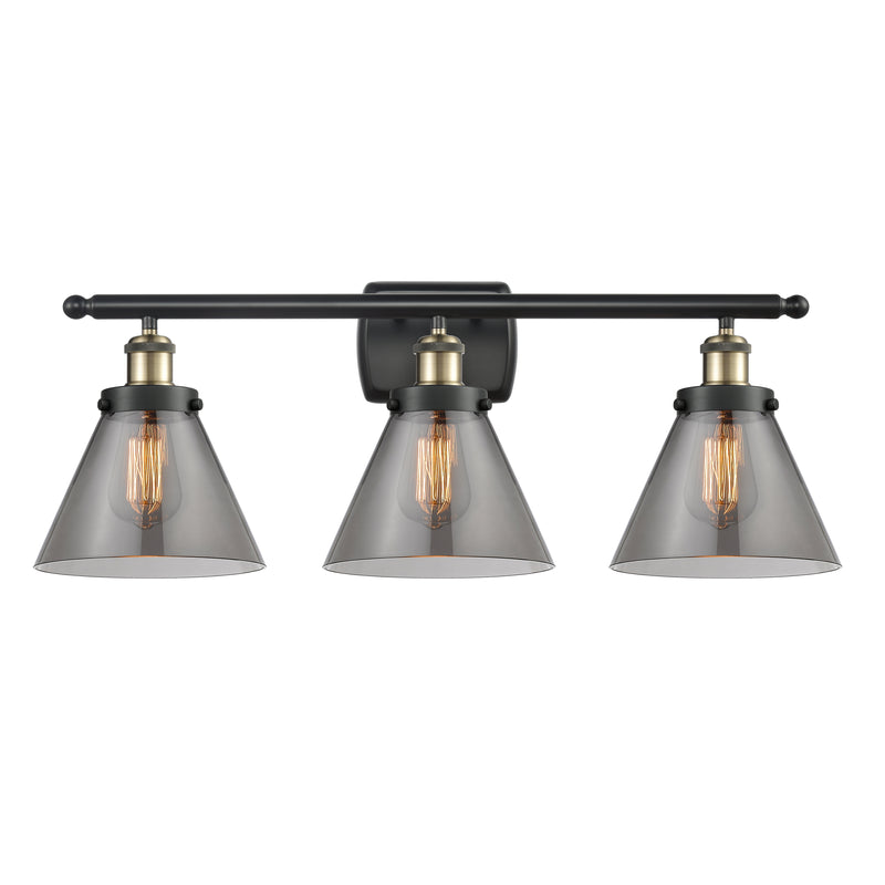 Cone Bath Vanity Light shown in the Black Antique Brass finish with a Plated Smoke shade