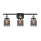 Bell Bath Vanity Light shown in the Black Antique Brass finish with a Plated Smoke shade