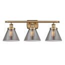 Cone Bath Vanity Light shown in the Brushed Brass finish with a Plated Smoke shade