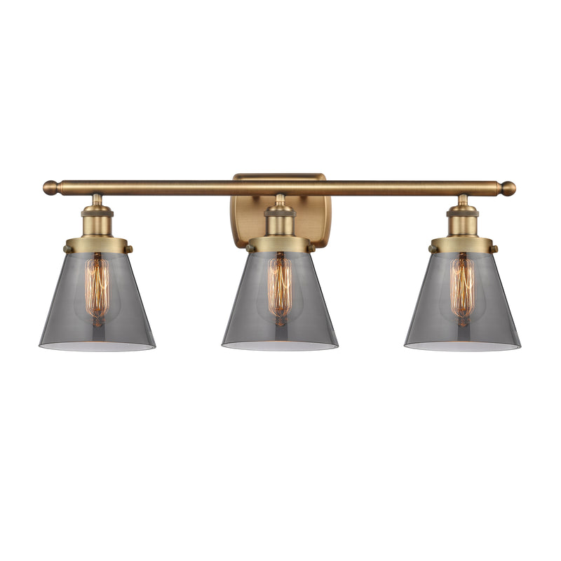 Cone Bath Vanity Light shown in the Brushed Brass finish with a Plated Smoke shade