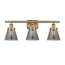 Cone Bath Vanity Light shown in the Brushed Brass finish with a Plated Smoke shade