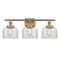 Bell Bath Vanity Light shown in the Brushed Brass finish with a Clear shade