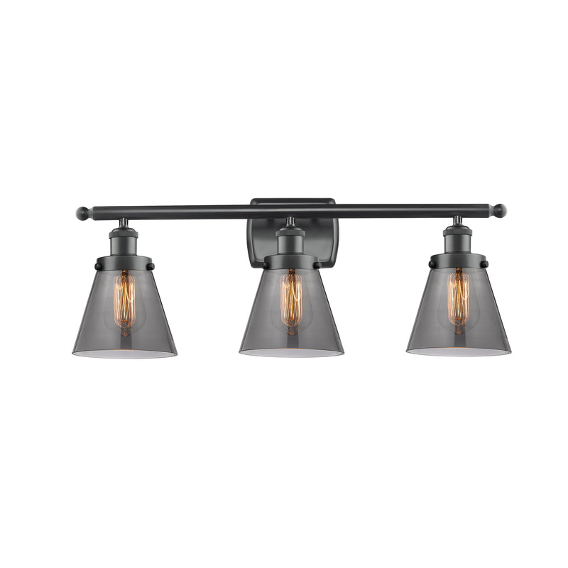 Cone Bath Vanity Light shown in the Matte Black finish with a Plated Smoke shade