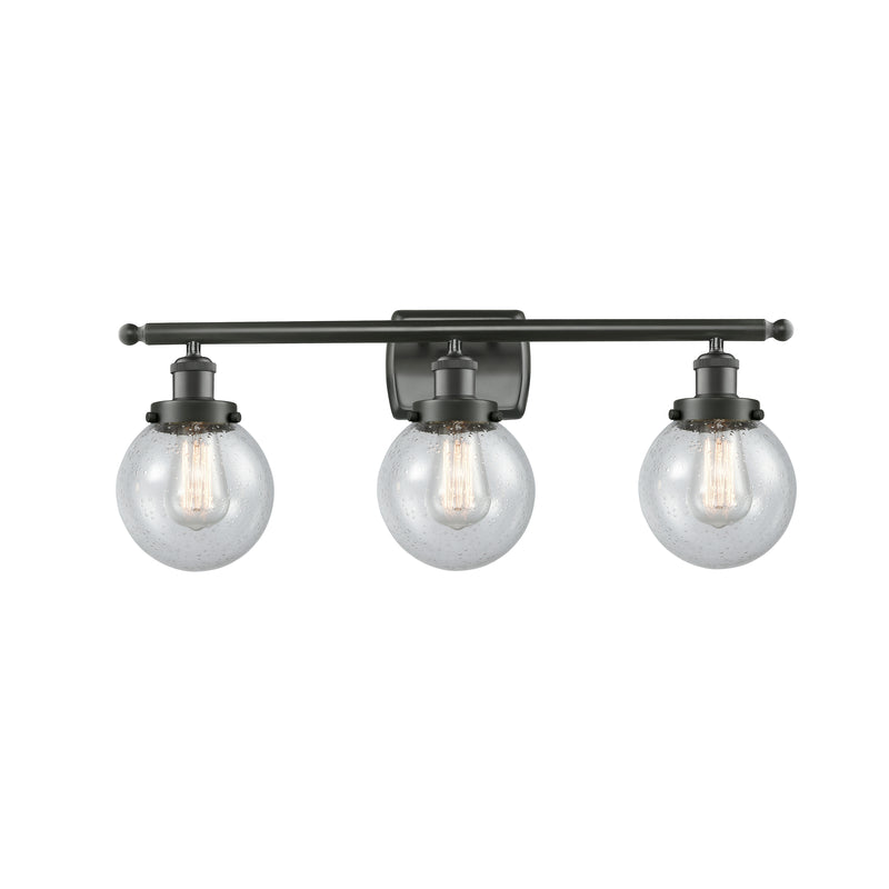 Beacon Bath Vanity Light shown in the Oil Rubbed Bronze finish with a Seedy shade