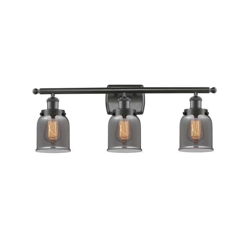 Bell Bath Vanity Light shown in the Oil Rubbed Bronze finish with a Plated Smoke shade