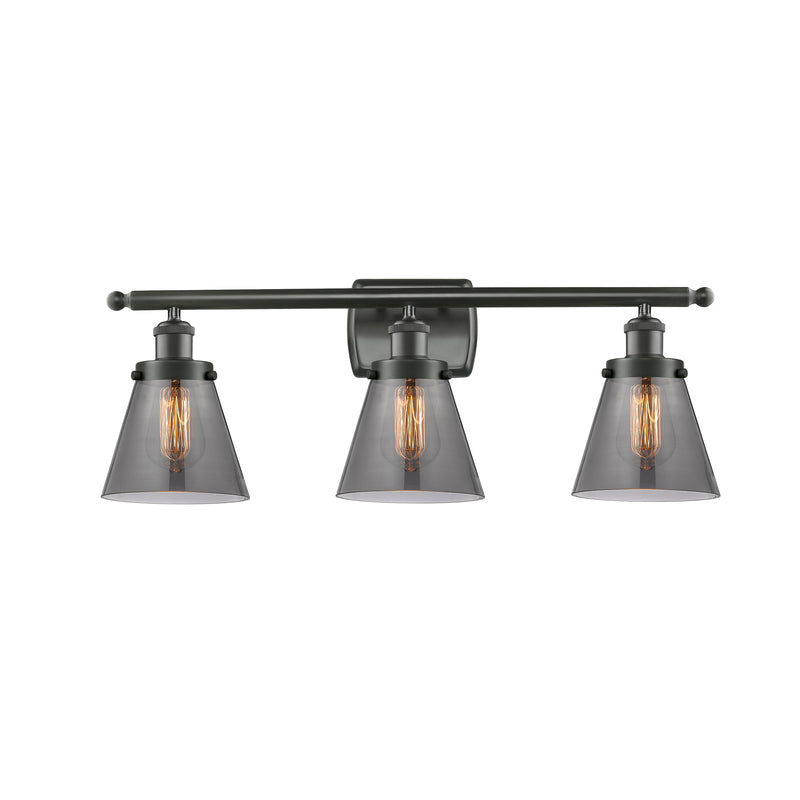 Cone Bath Vanity Light shown in the Oil Rubbed Bronze finish with a Plated Smoke shade