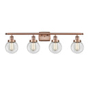 Beacon Bath Vanity Light shown in the Antique Copper finish with a Clear shade