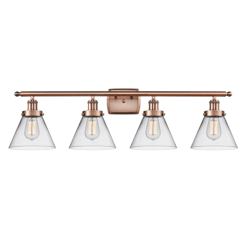 Cone Bath Vanity Light shown in the Antique Copper finish with a Clear shade