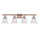 Cone Bath Vanity Light shown in the Antique Copper finish with a Seedy shade