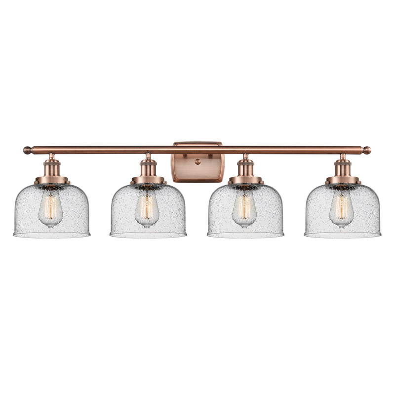 Bell Bath Vanity Light shown in the Antique Copper finish with a Seedy shade