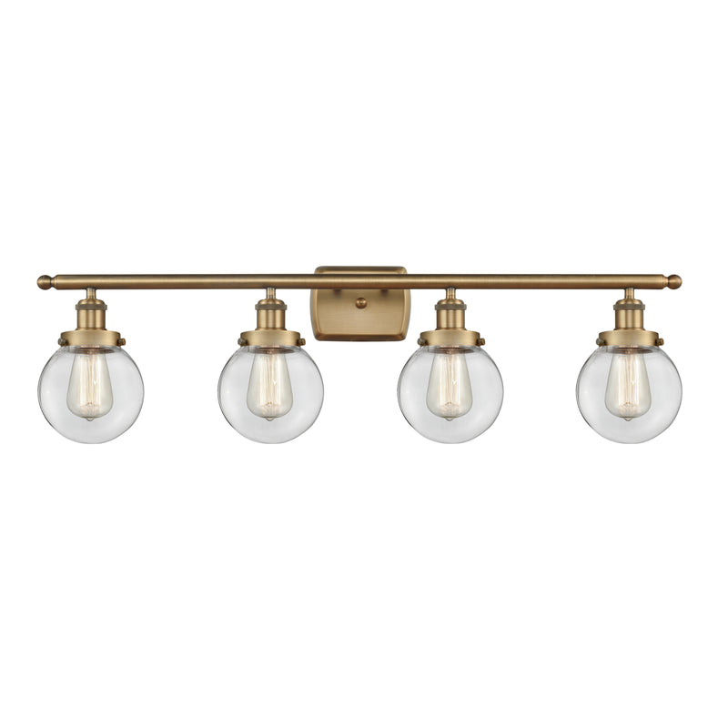 Beacon Bath Vanity Light shown in the Brushed Brass finish with a Clear shade