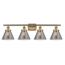 Cone Bath Vanity Light shown in the Brushed Brass finish with a Plated Smoke shade