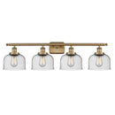 Bell Bath Vanity Light shown in the Brushed Brass finish with a Seedy shade