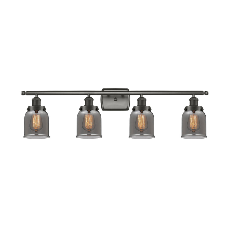 Bell Bath Vanity Light shown in the Oil Rubbed Bronze finish with a Plated Smoke shade