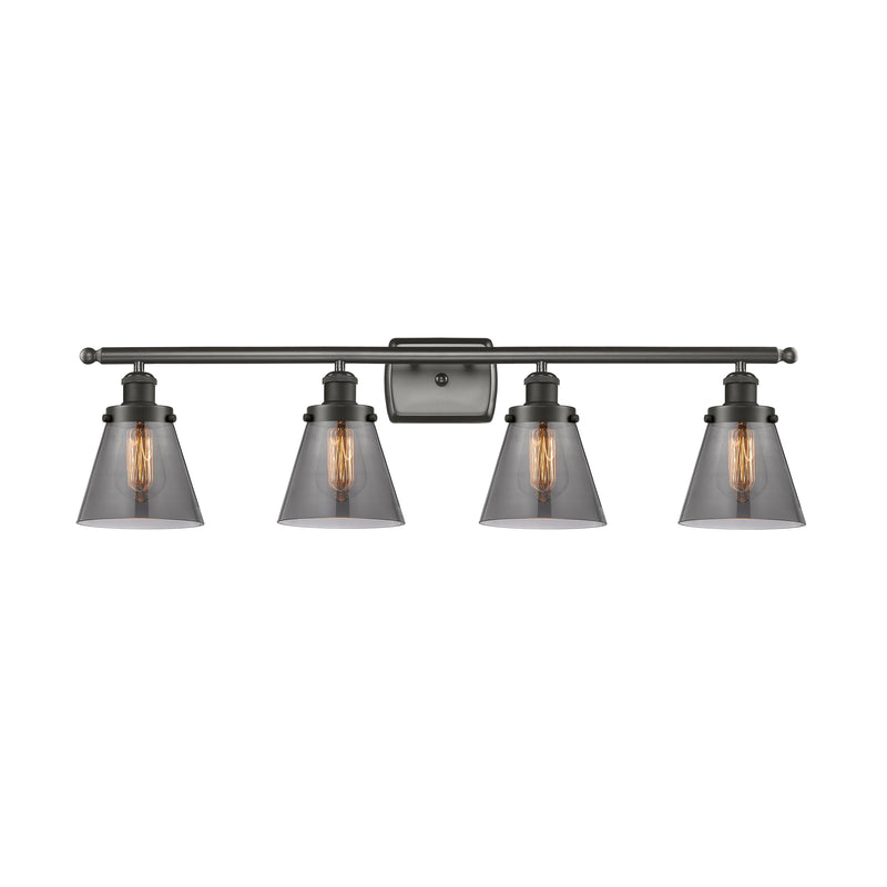 Cone Bath Vanity Light shown in the Oil Rubbed Bronze finish with a Plated Smoke shade