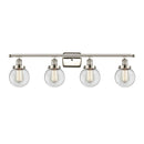 Beacon Bath Vanity Light shown in the Polished Nickel finish with a Clear shade