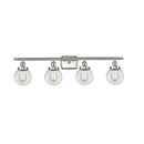 Beacon Bath Vanity Light shown in the Brushed Satin Nickel finish with a Clear shade